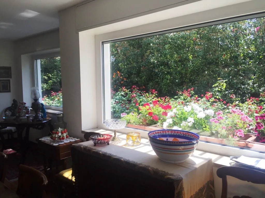 View of garden from living room in eight-room villa in Sanremo